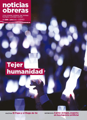 Cover of Noticias Obreras magazine showing a crowd waving glowing light sticks with the headline 'Tejer humanidad'.